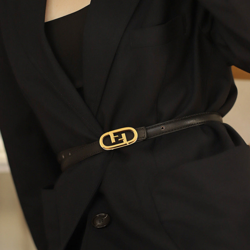 Black cowhide leather belt with oval gold buckle detail