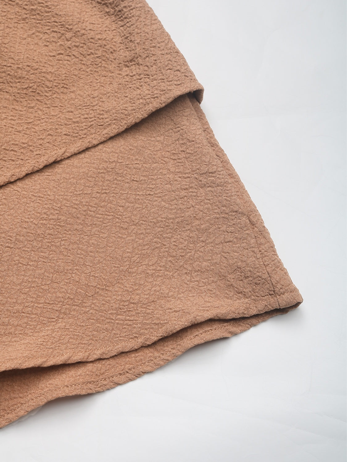 Camel tiered ruffle waistband shorts with textured fabric detail