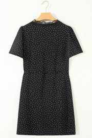 Black polka dot mini dress with short sleeves and lace neckline detail