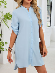 Light blue button-down shirt dress with band collar and rolled sleeves.