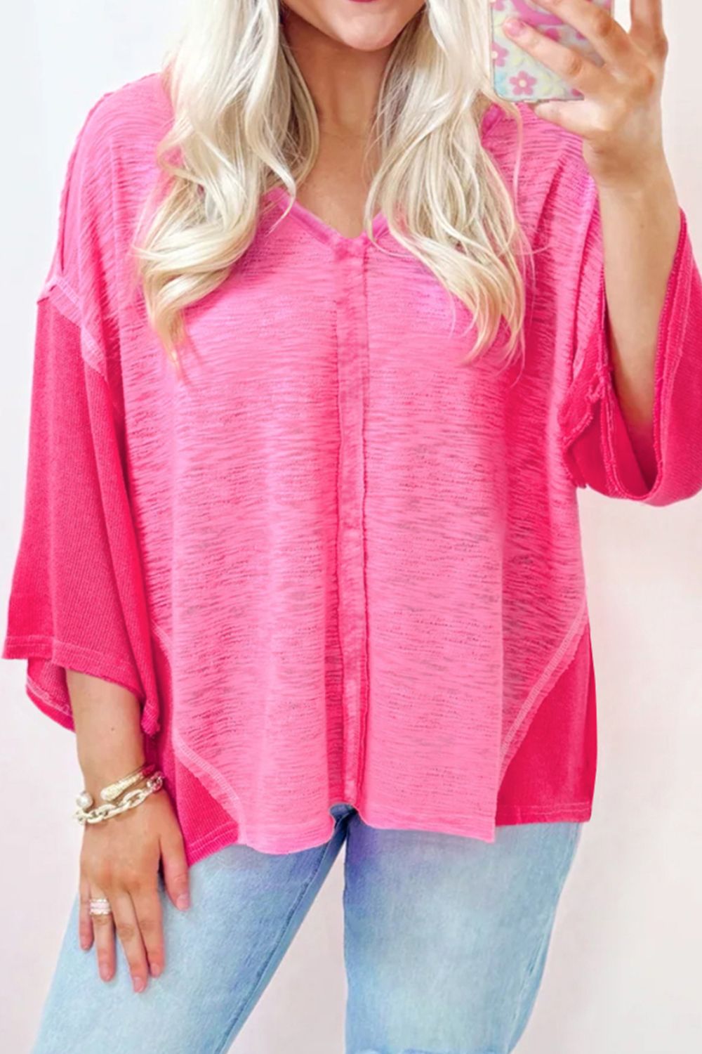 Hot pink contrast panel V-neck blouse with raw edge details and a relaxed fit.