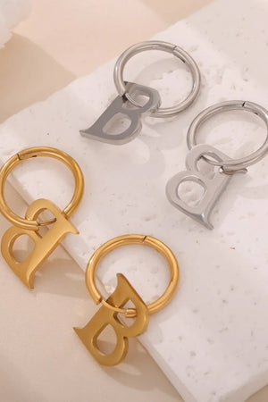 Initial letter B hoop earrings in gold and silver.