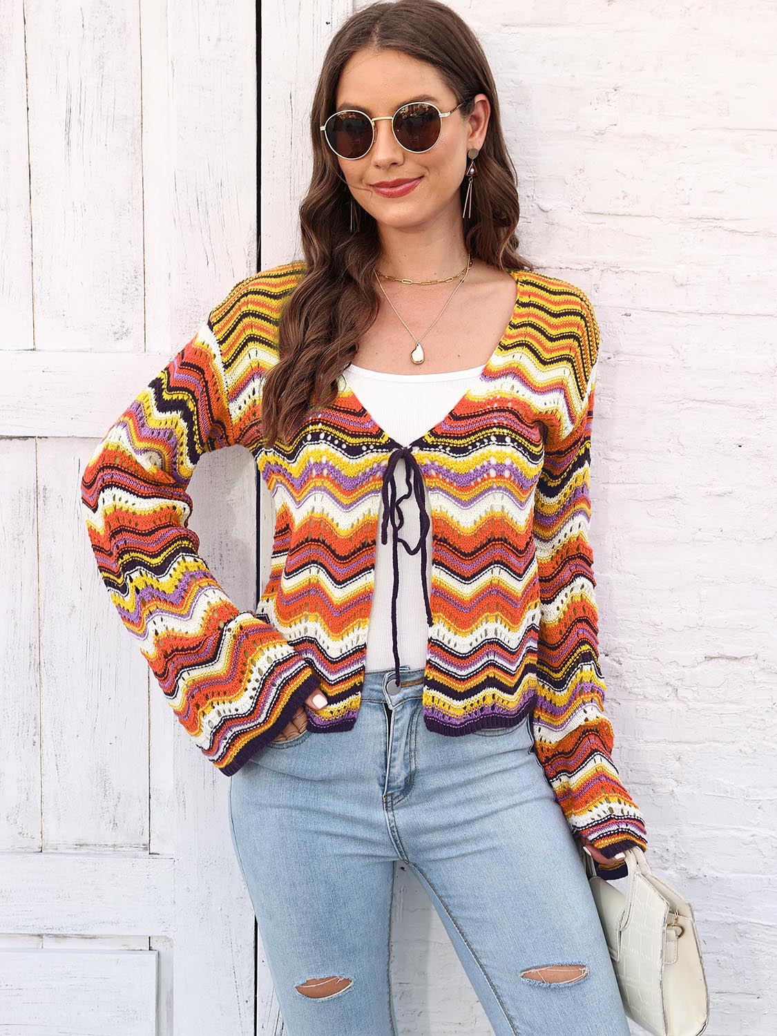 Chevron knit tie-front cardigan with multicolor zig-zag pattern and bell sleeves