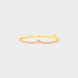 Gold tennis bracelet with pink heart zirconia charm and pink stones