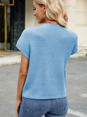 Pastel Blue knit cap-sleeve top with ribbed texture and a subtle pocket detail.