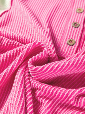 Fuchsia pink henley t-shirt with textured stripes and wooden buttons.