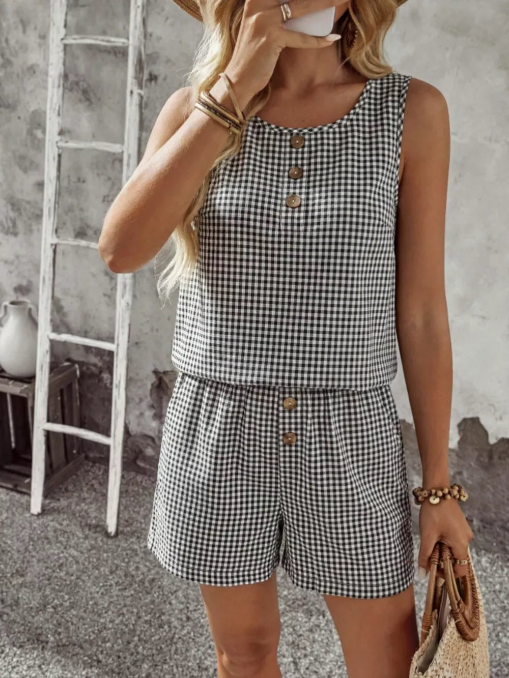 Black gingham two-piece set with button detail on top and shorts.