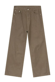 Brown wide-leg denim jeans with angular seams and a casual fit.