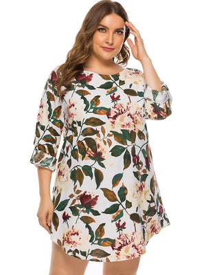 Botanical print trapeze mini dress in Ivory with 3/4 sleeves and a round neckline.