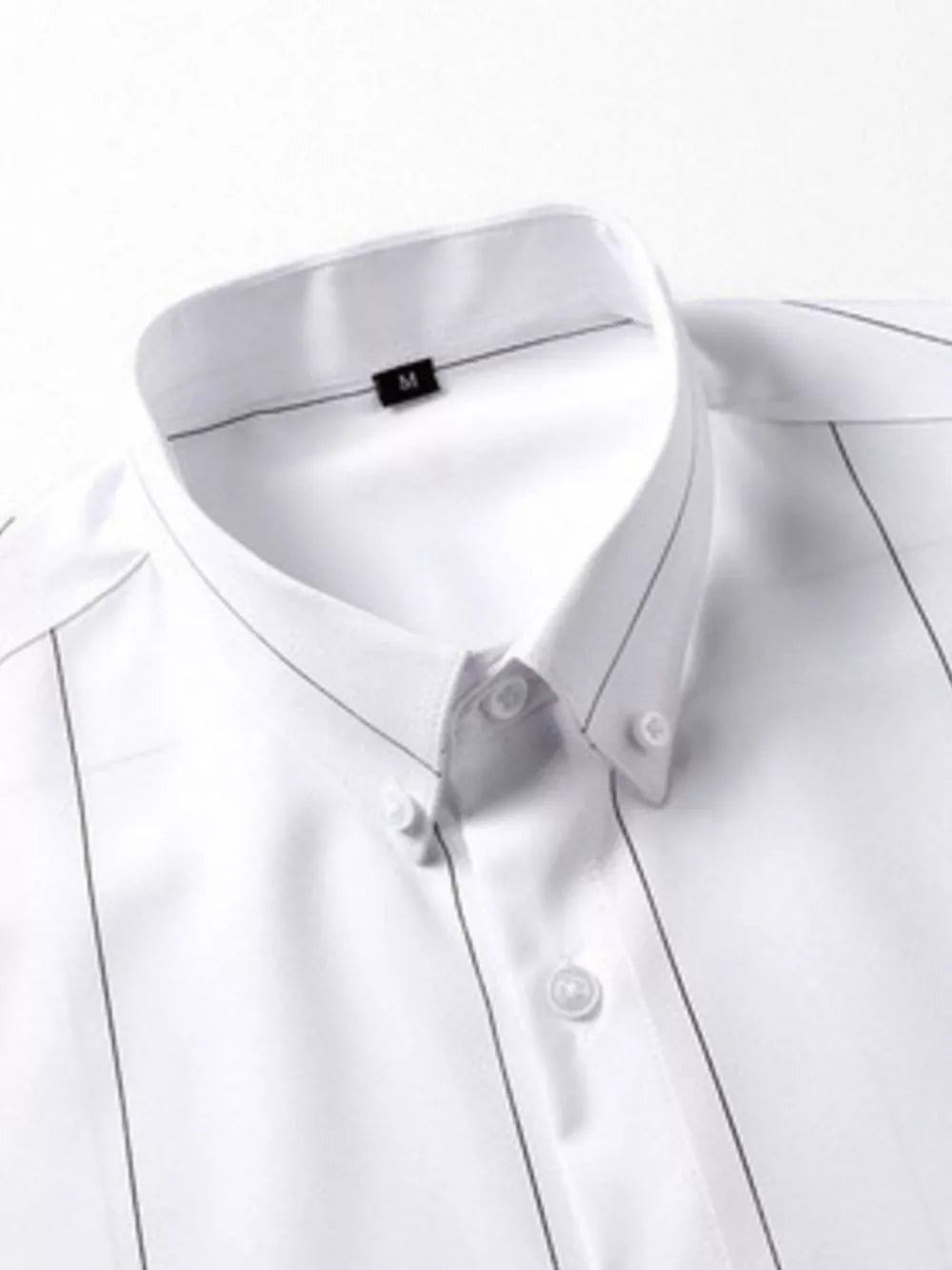 White cotton button-down overshirt with thin pinstripe pattern and button collar.