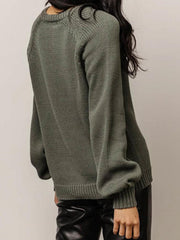 Army green acrylic knit sweater with balloon sleeves and buttoned henley neckline.