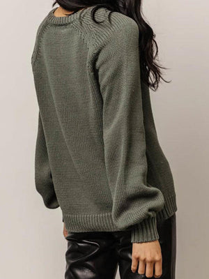 Army green acrylic knit sweater with balloon sleeves and buttoned henley neckline.
