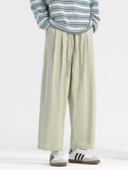 Men's sage wide-leg drawstring casual trousers with a relaxed fit.