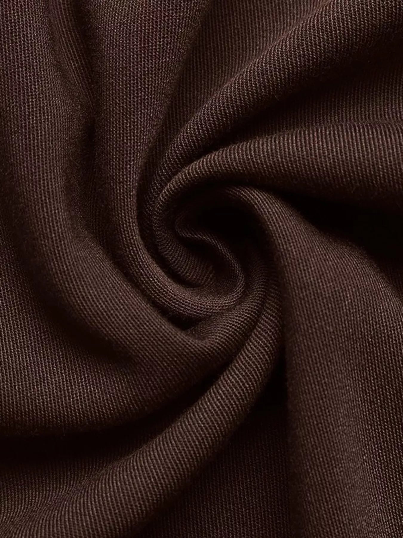 Brown A-line midi dress fabric detail, showing textured knit and soft drape.