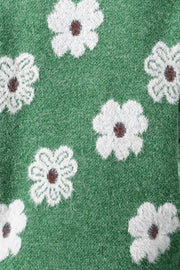 Dark green acrylic sweater with white intarsia floral pattern and brown centers.