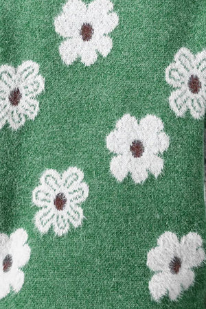 Dark green acrylic sweater with white intarsia floral pattern and brown centers.