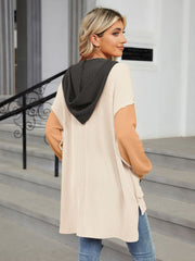 Waffle knit colorblock tunic with contrast sleeves and hood, side pockets.