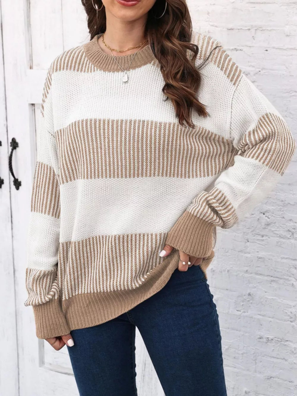 Cozy knit sweater with tan and white stripes, crew neck, long sleeves.