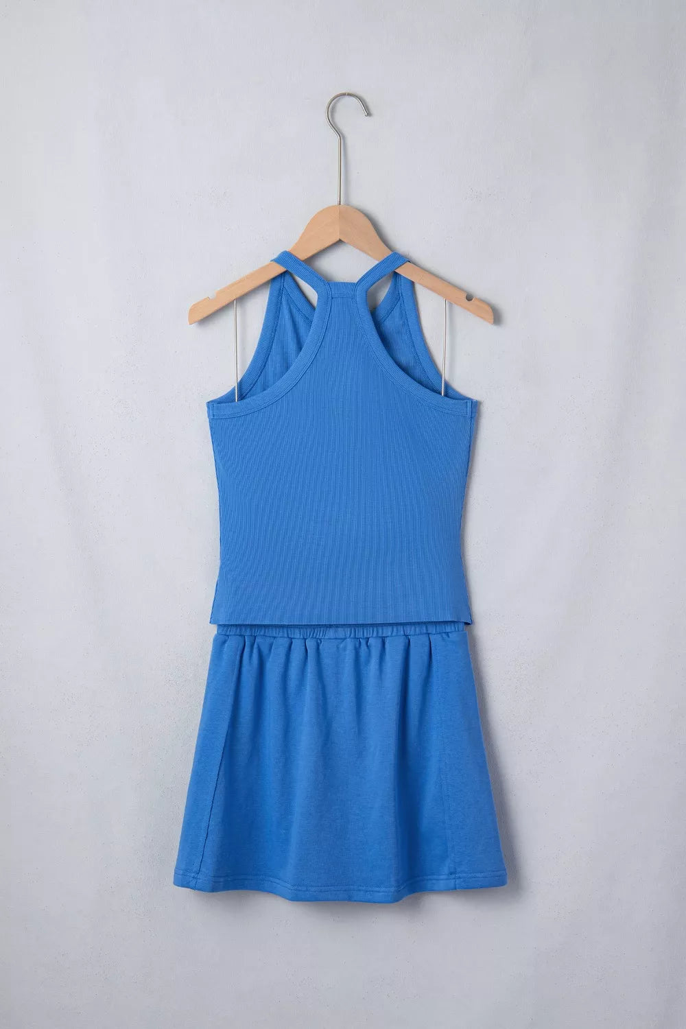 Blue ribbed cropped tank top and skort set with elastic waistband.