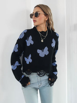 Black cropped knit sweater with distressed butterfly print and frayed hem