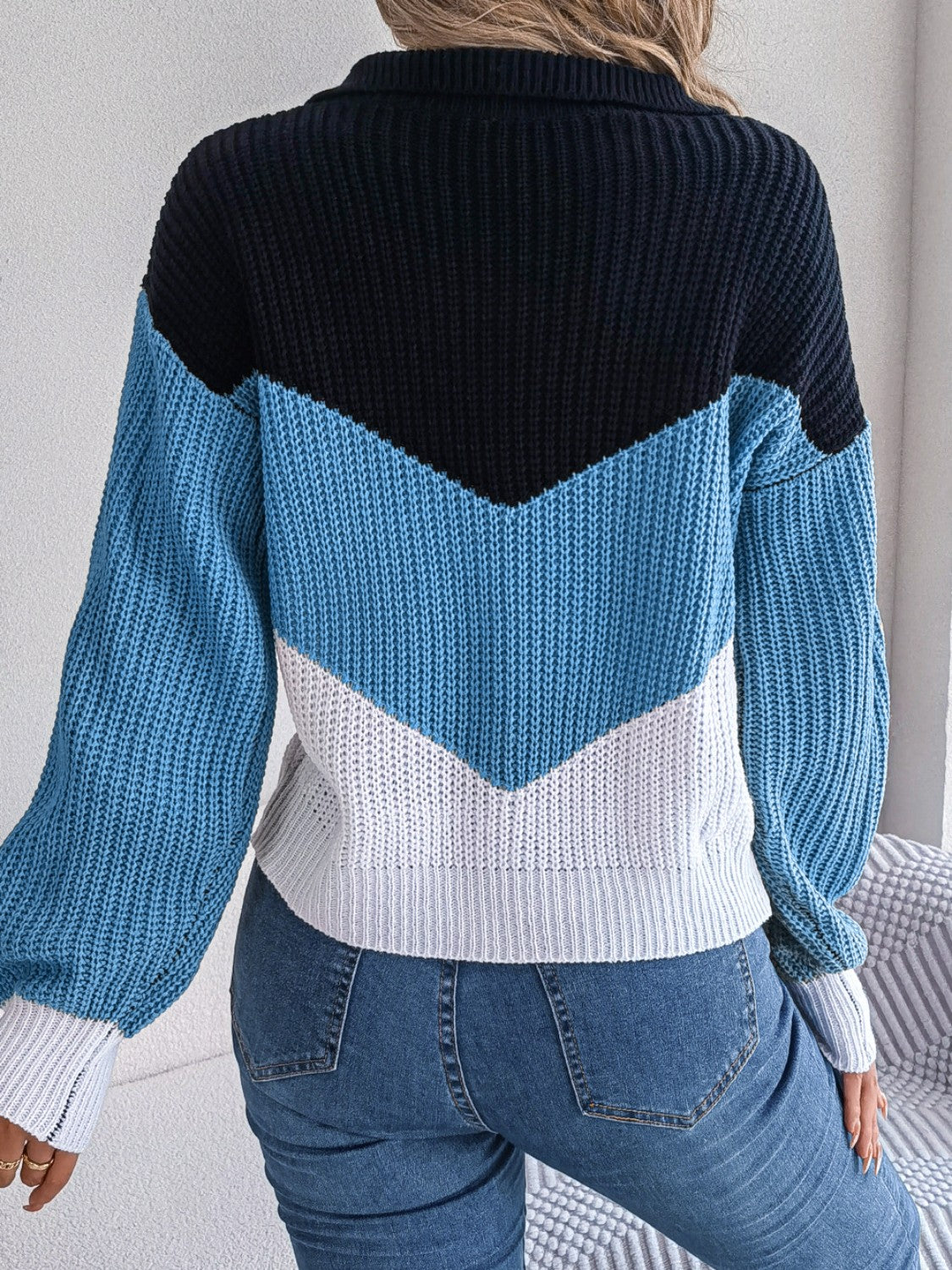 Chevron block knit polo sweater in acrylic with blue, white, and black color blocking.