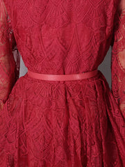 Red lace midi dress with ornate pattern and matching belt.