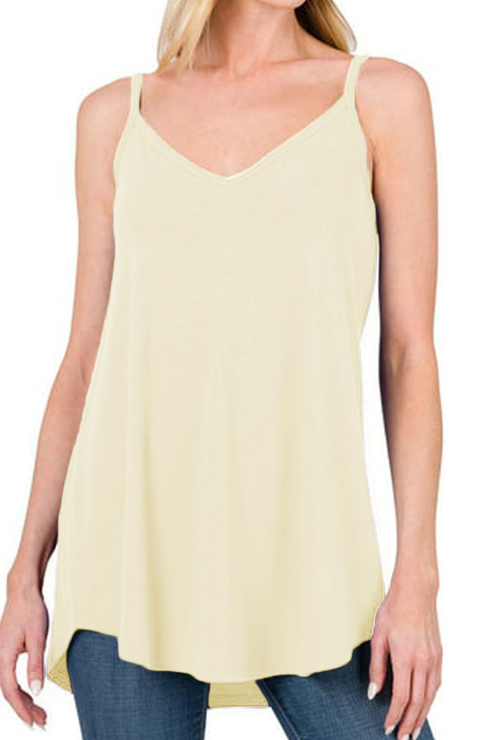 Ivory cami with spaghetti straps and curved hemline