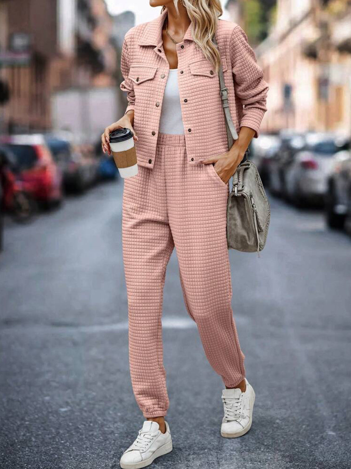Quilted co-ord set in watermelon pink, featuring a button-up jacket with pockets and jogger pants.