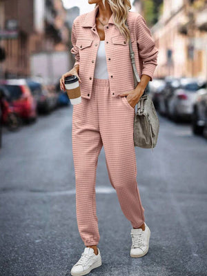 Quilted co-ord set in watermelon pink, featuring a button-up jacket with pockets and jogger pants.