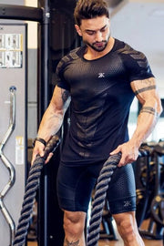 Men's black performance mesh sculpt tee with textured pattern and short sleeves.