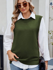 Army green ribbed knit vest with side buttons, crew neck, acrylic material, worn over a white shirt.