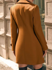 Caramel wool blend trench coat with double-breasted detail and cuffed sleeves.