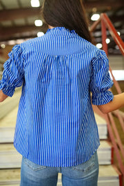 Blue striped cotton blend shirt with ruffled puff sleeves and button placket.