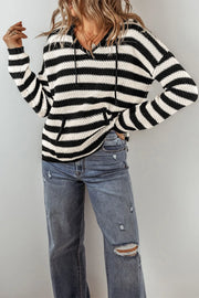 Black and white striped knit hoodie with pouch pocket and adjustable drawstring hood.