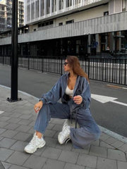 Plush velour lounge set in blue with wide leg pants and zip-up hoodie.