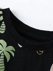 Black cotton toddler tee with tropical palm tree print and gold detail.