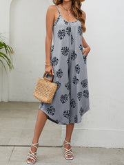 Monstera print culotte jumpsuit in Gray Dawn with gathered bust and pockets.