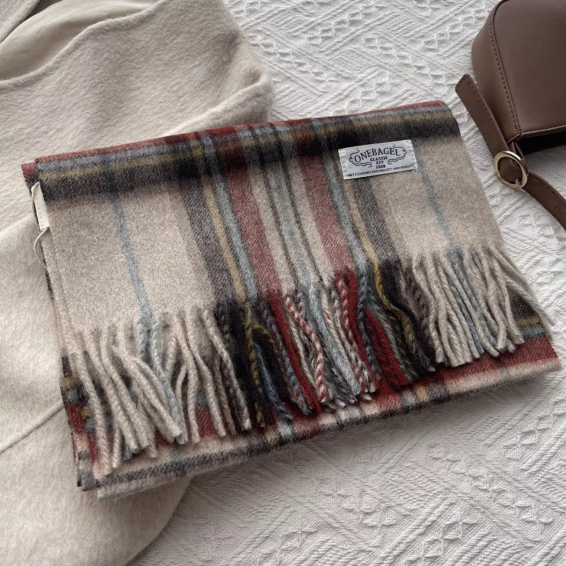 Classic wool plaid scarf with tassels in burgundy, blue, and grey tones.