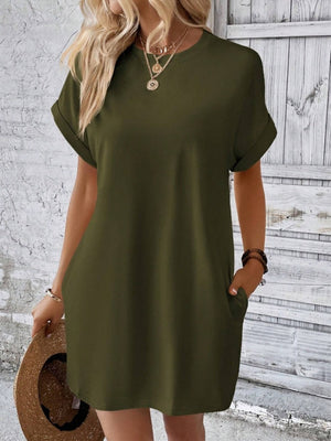 Army green relaxed tee dress with cuffed sleeves and pockets, styled casually.
