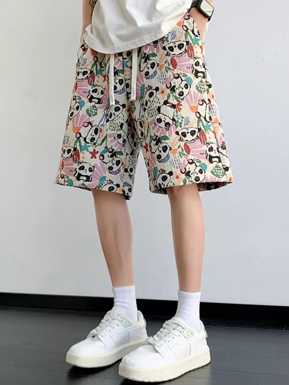 Lightweight chino shorts with panda print and drawstring waist.