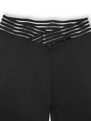Black flare leggings with a crossover waistband featuring striped elastic detail
