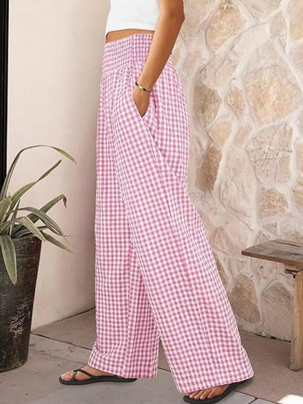 Pink plaid gingham maternity pants with smocked waistband and wide legs.