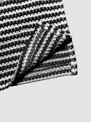 Maternity wide leg trousers in black and white stripe waffle knit fabric.