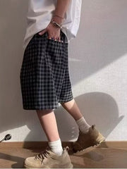 Men's dark gray plaid drawstring shorts with pockets