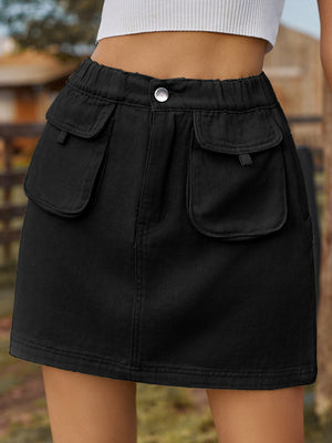 Black denim mini skirt with elastic waist and buttoned cargo pockets.