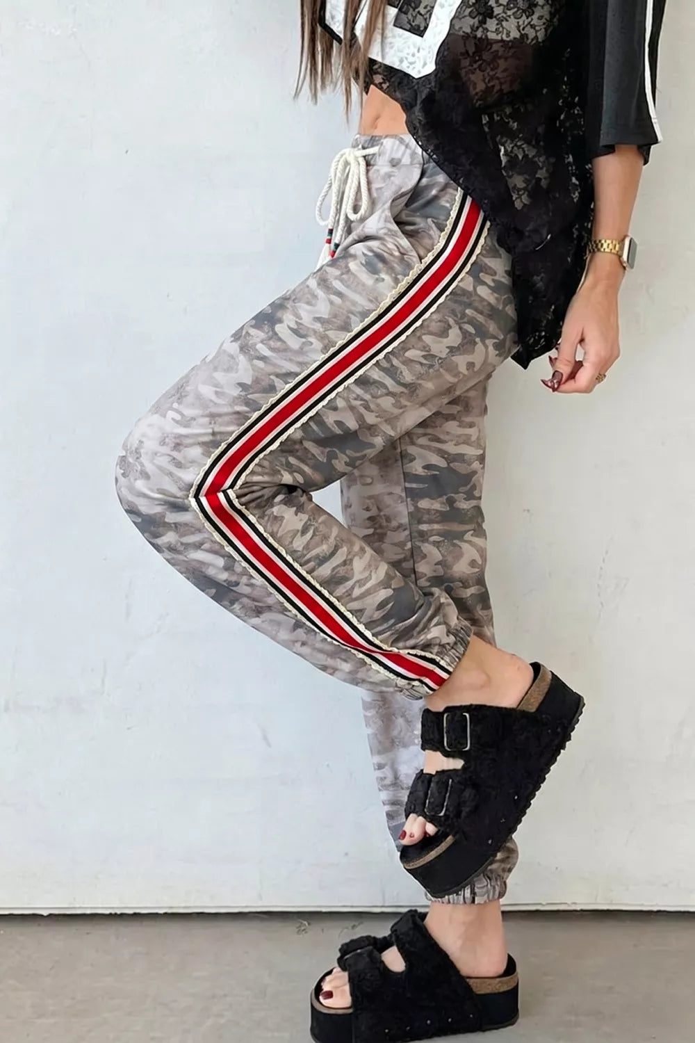 Camo print relaxed fit maternity pants with drawstring and side stripe detail.