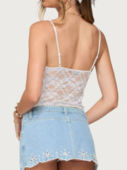 White sheer floral lace cami with adjustable straps and a cropped cut.