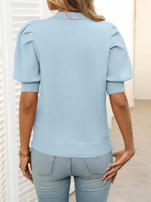 Light blue knit sweater with mock neck and puff sleeves