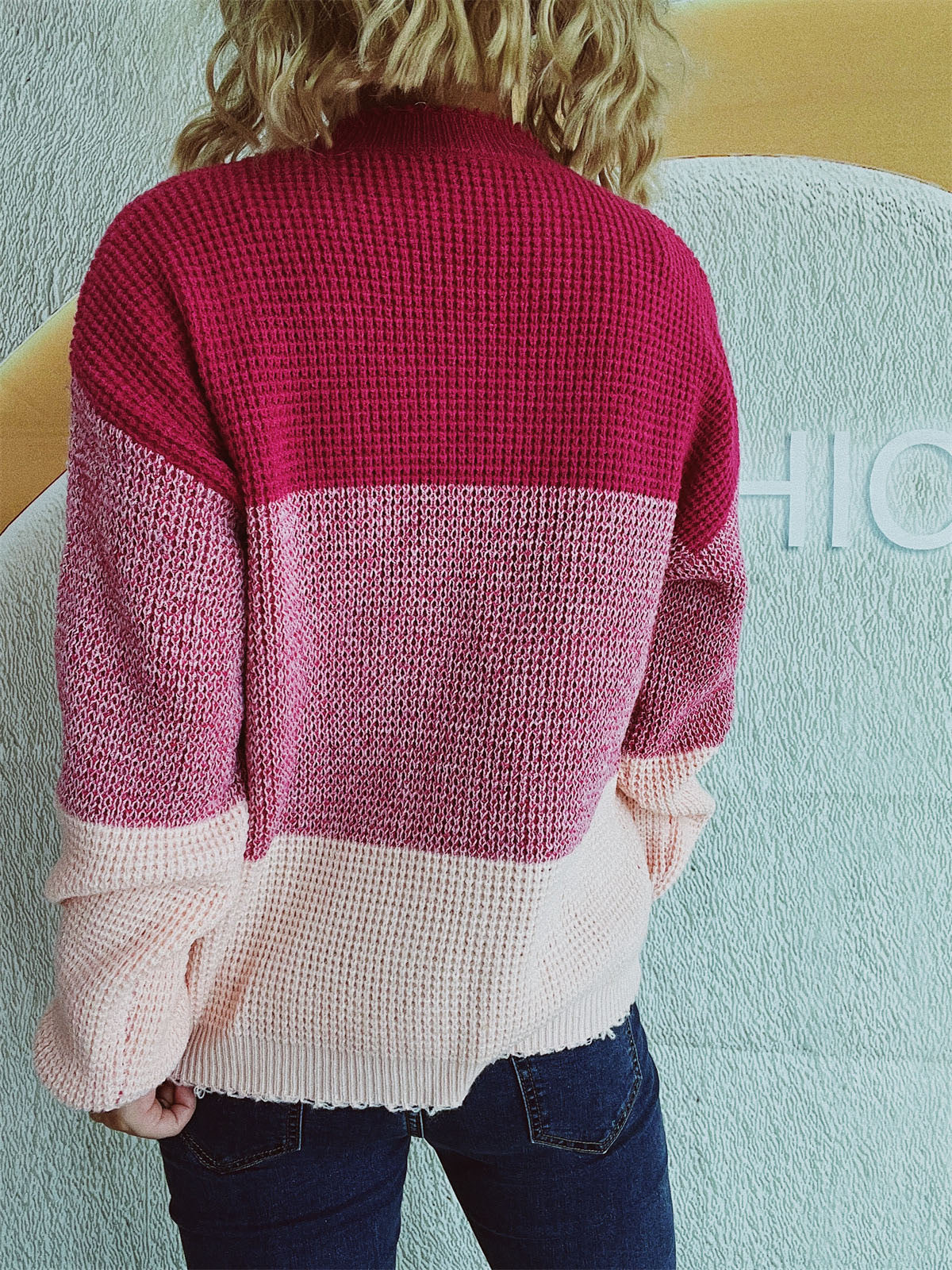 Colorblock textured knit pullover sweater in pink and maroon with waffle knit detail.