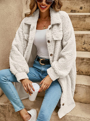 White teddy bear shacket with oversized fit, button-down front and chest pockets.